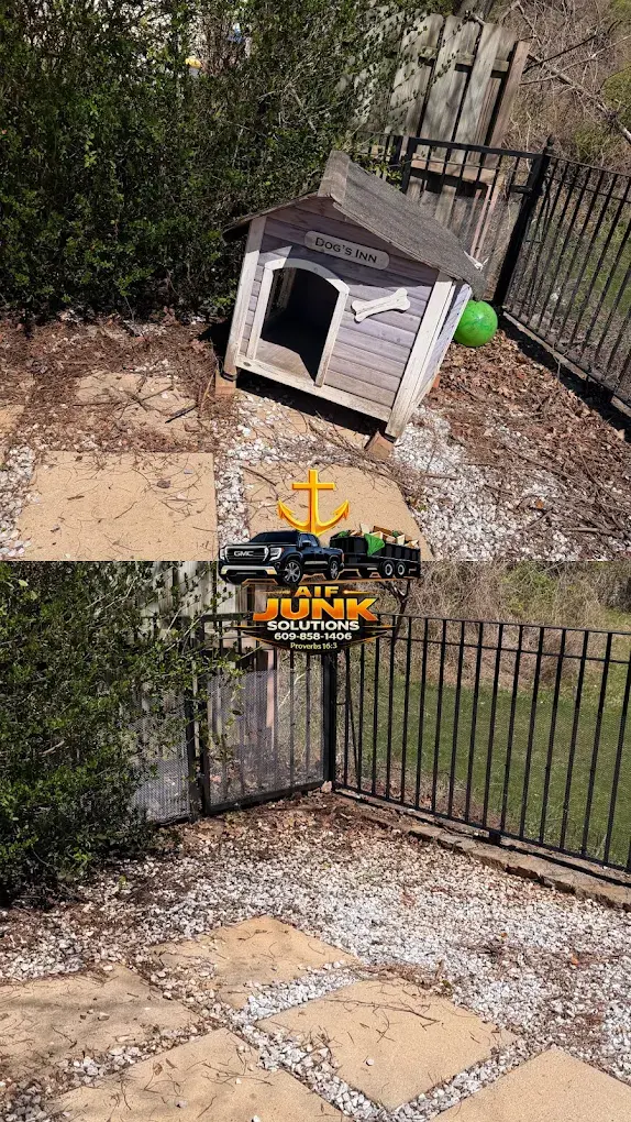 Old dog house removed from a fenced backyard